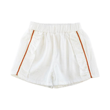 Toddler girl's white ruffle shorts with silver dots and orange lurex straps