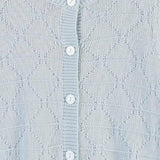 Knitted cardigan, stitch and button detail