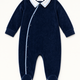 Bebe Sweeny navy velour babygrow with white collar and light blue ric-rac trim, front view