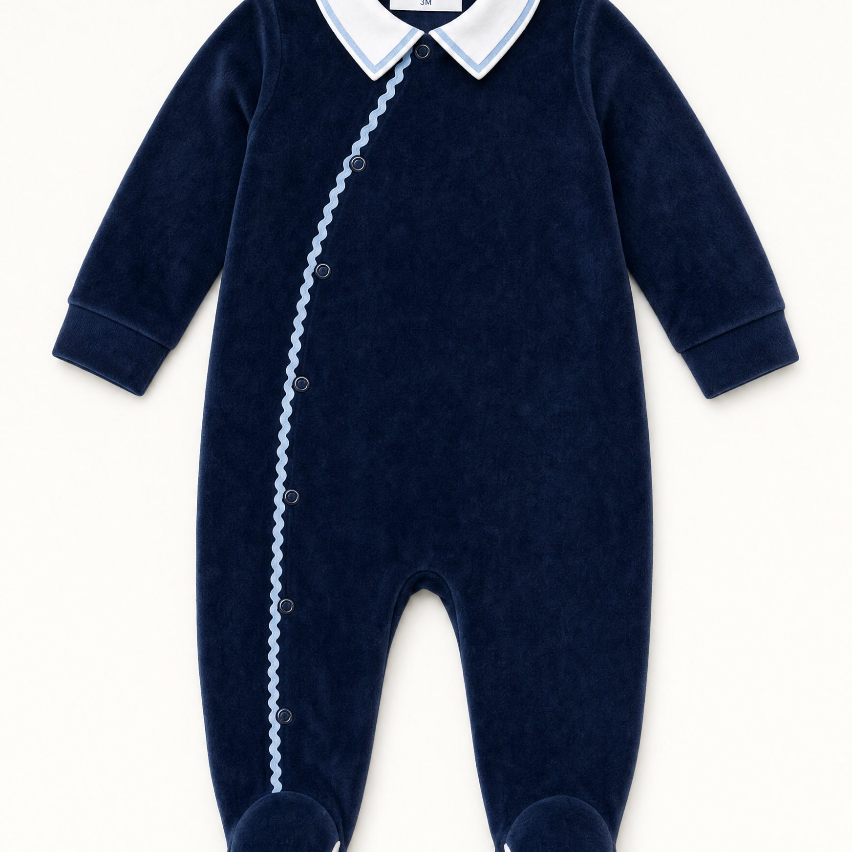 Bebe Sweeny navy velour babygrow with white collar and light blue ric-rac trim, front view