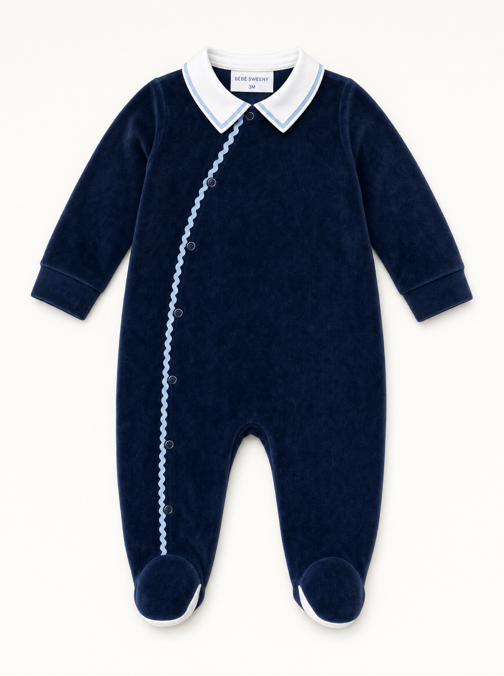 Bebe Sweeny navy velour babygrow with white collar and light blue ric-rac trim, front view